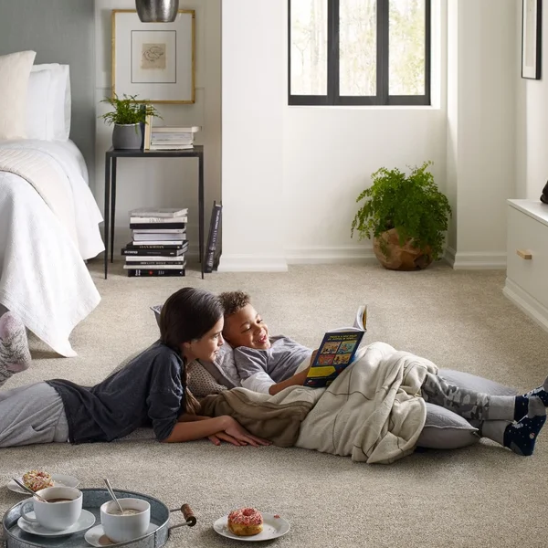 kids reading in bedroom on a soft beige carpet from May's Lone Star Flooring on Atlanta, TX area
