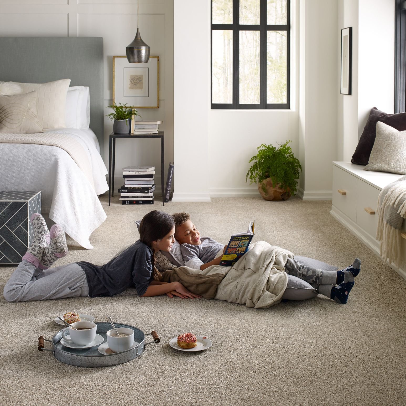 kids reading in bedroom on a soft beige carpet from May's Lone Star Flooring on Atlanta, TX area