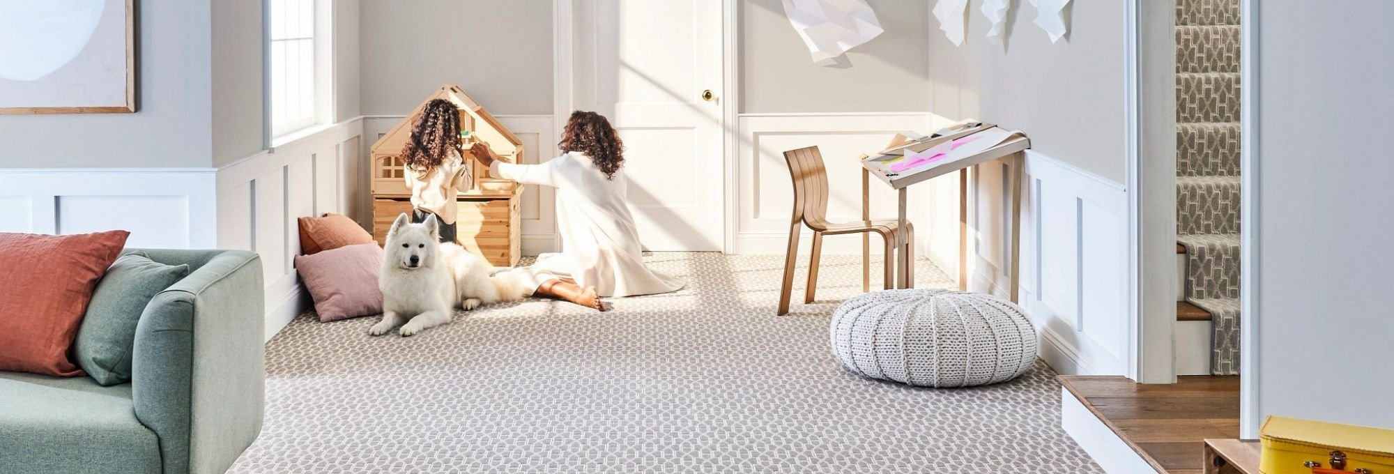 mother and daughter playing on soft carpet from May's Lone Star Flooring on Atlanta, TX area